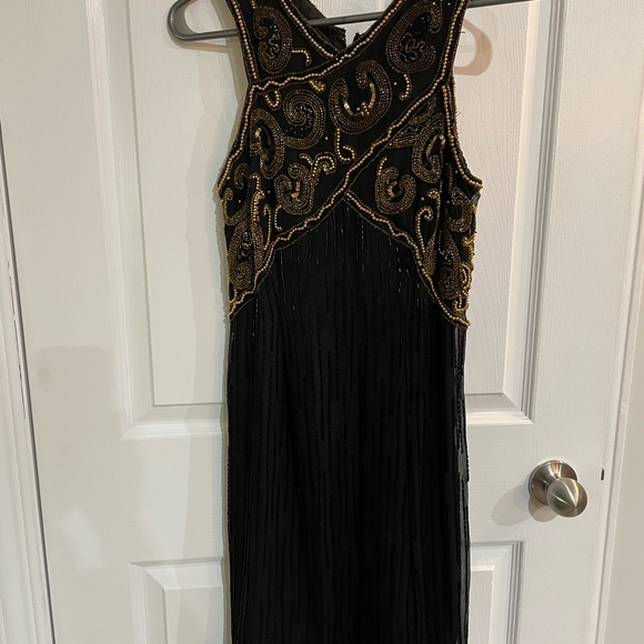 All silk hand beaded black dress with gold beading . Fits as women’s small . - Picture 6 of 6